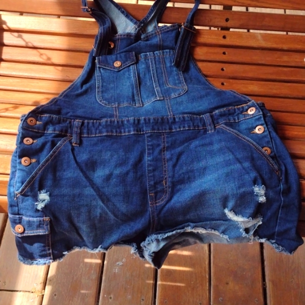 A pair of jean bibs with shorts